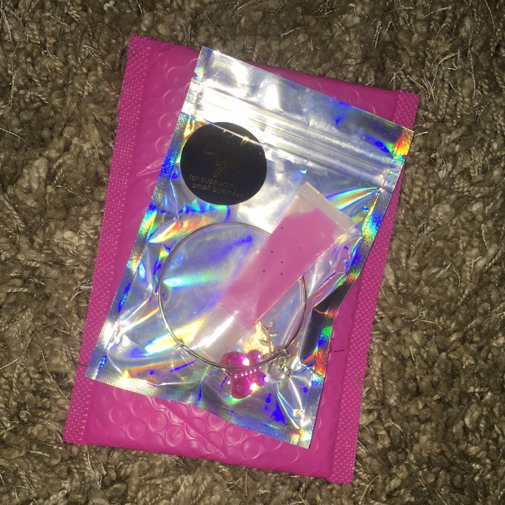 one lip gloss and one bracelets in this package